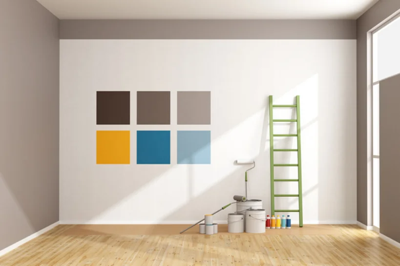 Farbmisch-Service - Malerhandewerk Service unterschiedliche Farbfelder an einer Wand mit Farbdosen und Rollen auf dem Boden